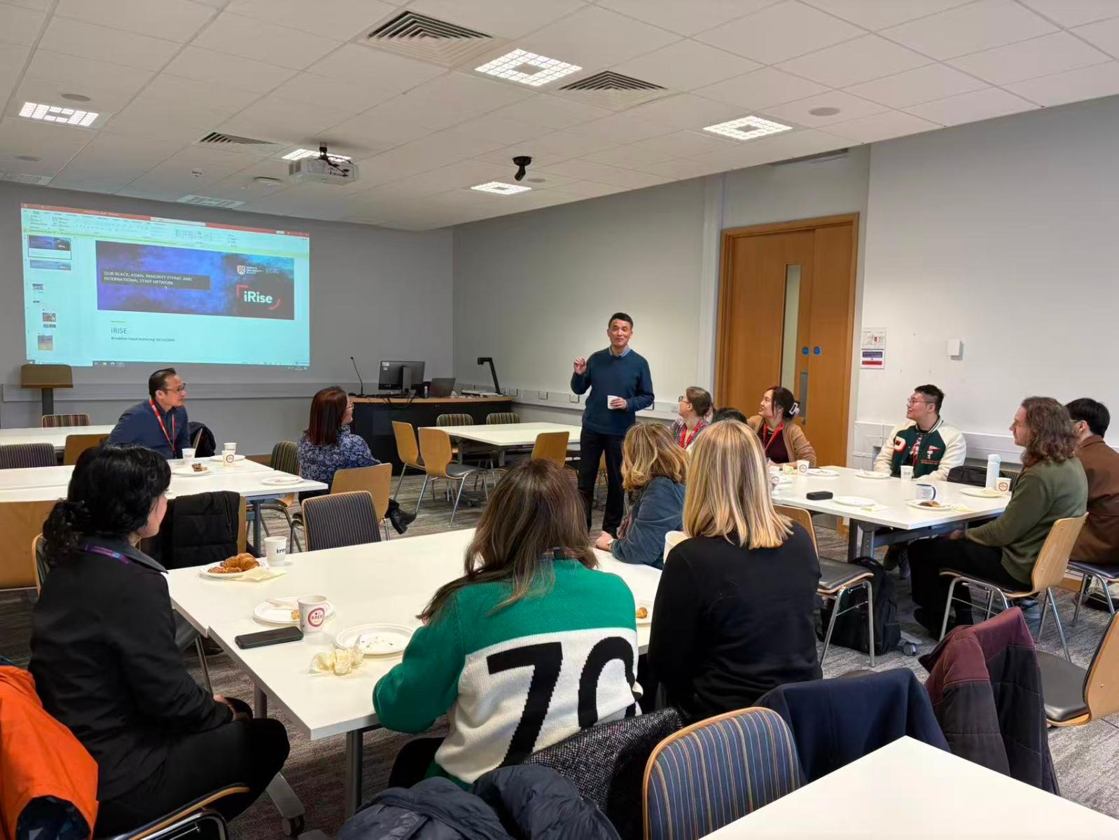 iRise Winter Social 16th Dec 25 - Prof Wei Sha giving a speech about REC with iRise logo